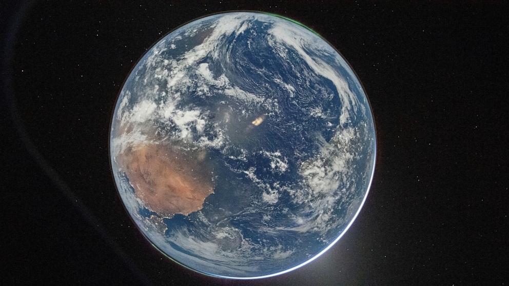 PHOTO: NASA astronaut and Artemis II Commander Reid Wiseman took this picture of Earth from the Orion spacecraft's window on April 2, 2026, after completing the translunar injection burn.