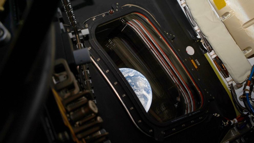 PHOTO: A view of Earth taken by NASA astronaut and Artemis II commander Reid Wiseman from one of the Orion spacecraft's four main windows after completing the translunar injection burn on April 2, 2026.