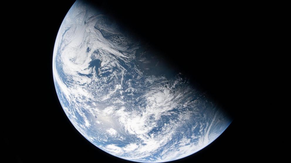 PHOTO: A view of Earth taken by NASA astronaut and Artemis II Commander Reid Wiseman from one of the Orion spacecraft's four windows after completing the translunar injection burn on April 2, 2026.