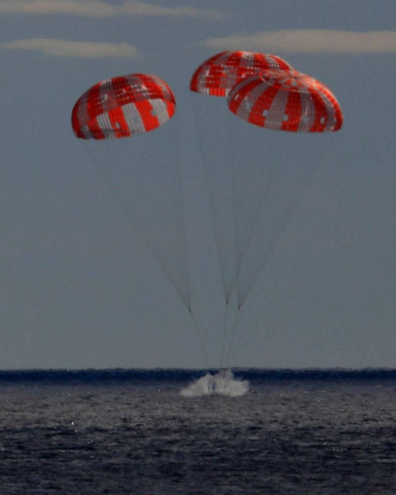 PHOTO: In this photo provided by NASA the Orion spacecraft for the Artemis I mission splashes down in the Pacific Ocean after a 25.5 day mission to the Moon, Dec. 11, 2022.