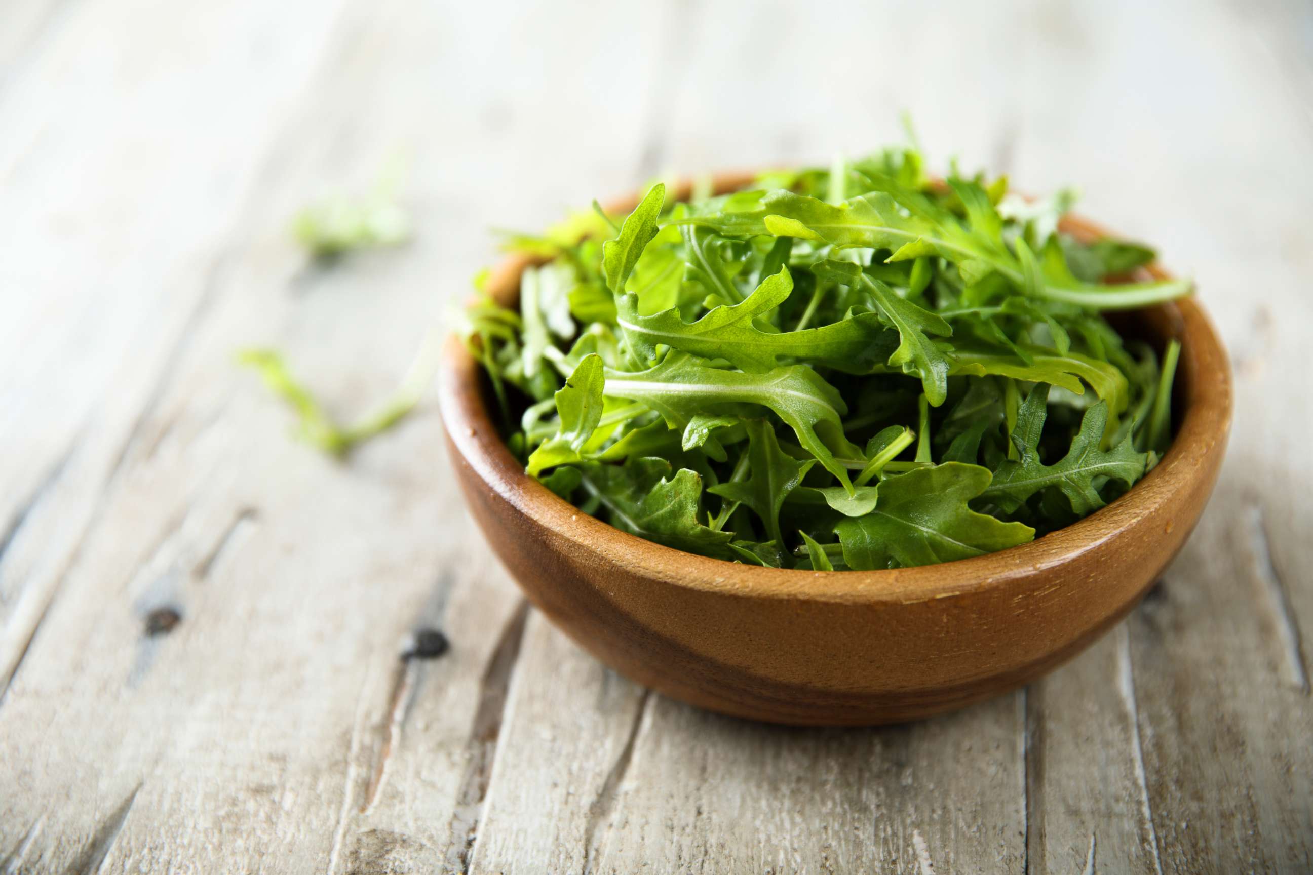 PHOTO: Fresh arugula in a wooden bowl is seen in this stock photo.
