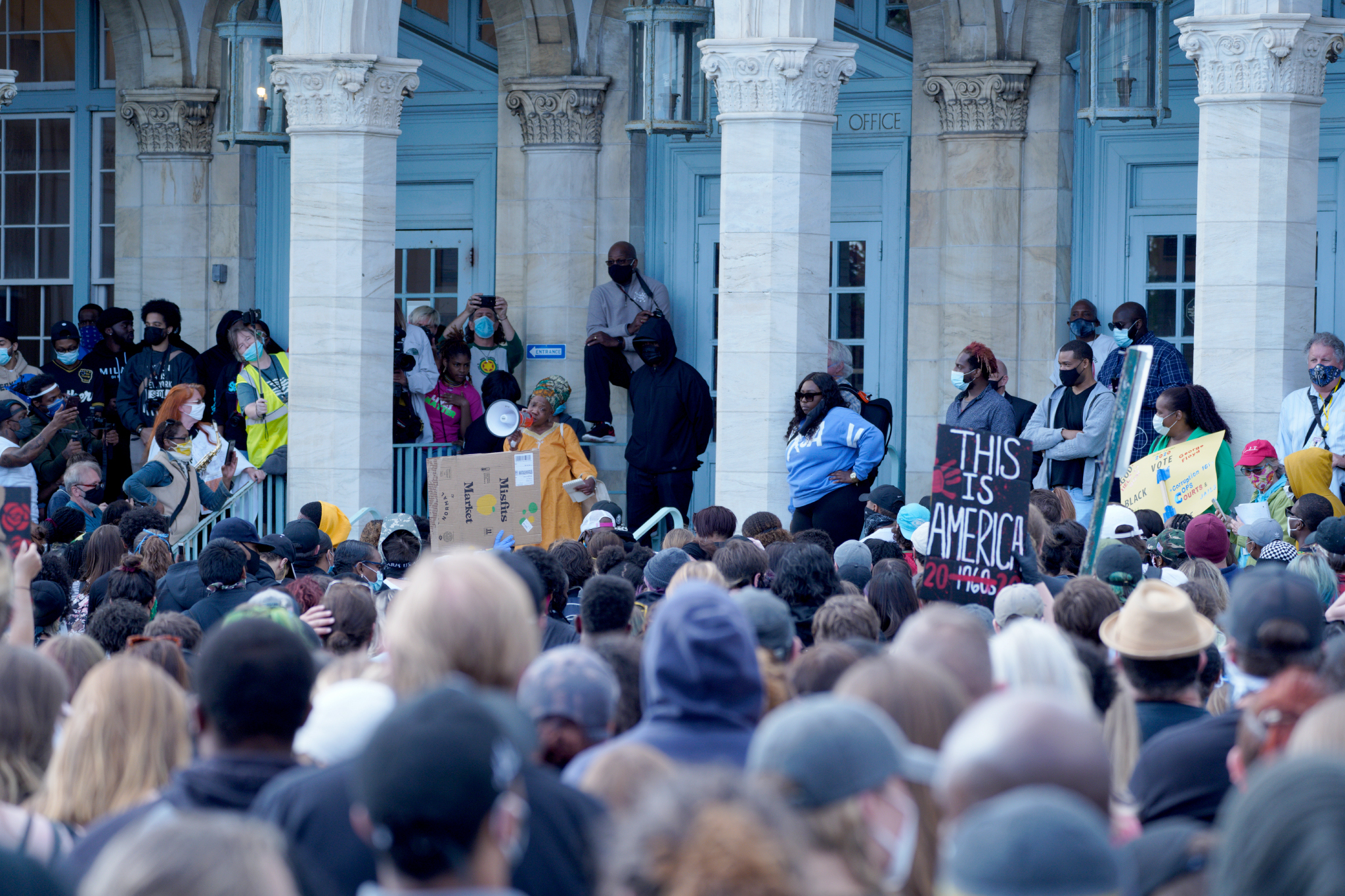 PHOTO: Crowd listening to a speaker on the steps of the Asbury Park post office.