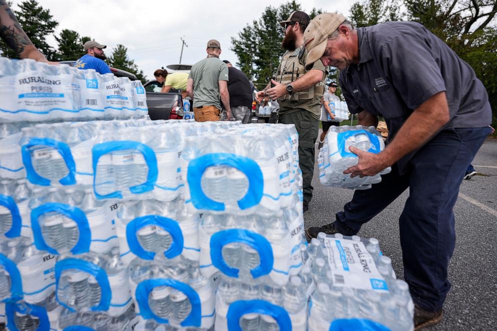 PHOTO: Volunteers stage water for people in the aftermath of Hurricane Helene, Monday, Sept. 30, 2024, in Asheville, N.C.