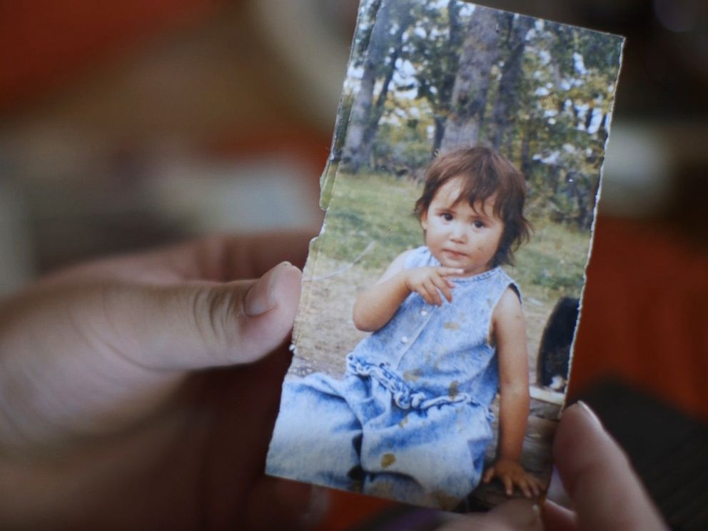 PHOTO: Kimberly Loring holds a childhood portrait of her sister, Ashley Loring HeavyRunner, who has been missing since June 2017.