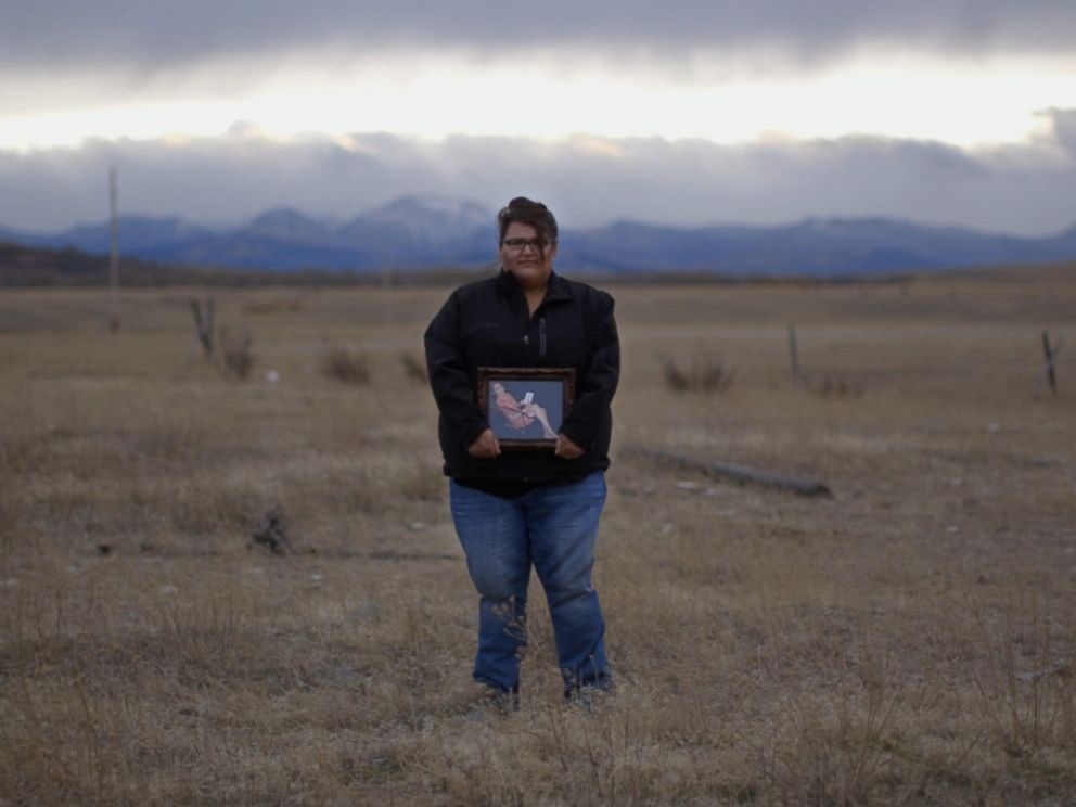 PHOTO: Kimberly Loring holds a portrait of her younger sister Ashley Loring HeavyRunner, who has been missing for more than four months.