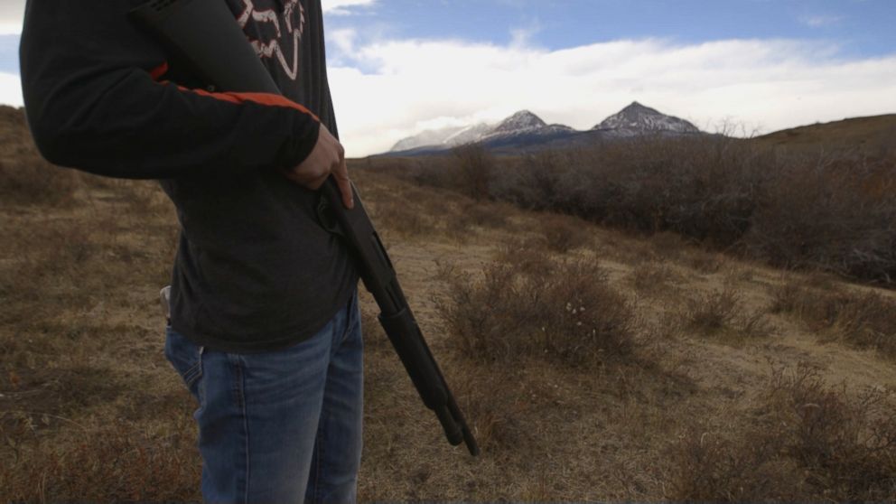 PHOTO: A volunteer carries a shotgun as protection against wildlife on a recent mountain search for Ashley Loring HeavyRunner. 