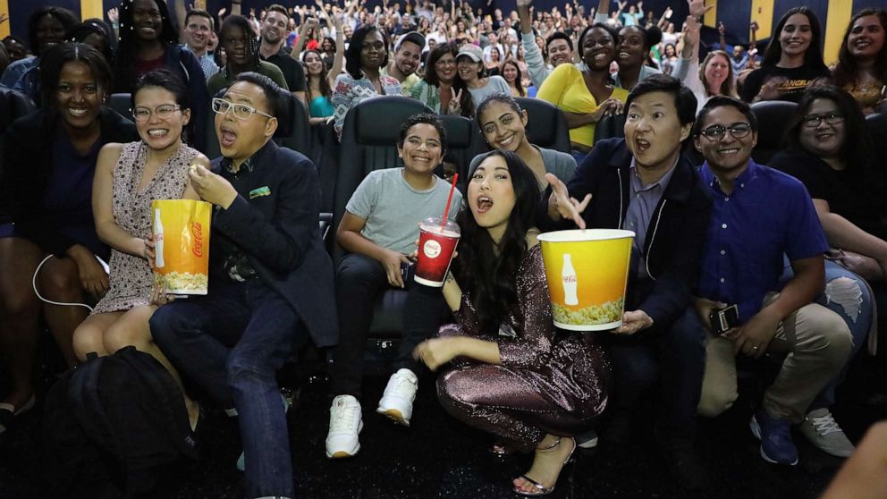 PHOTO:Nico Santos, Awkwafina and Ken Jeong pose with fans at Regal Cinemas 18 South Beach for the "Crazy Rich Asians" screening, July 31, 2018 in Miami.