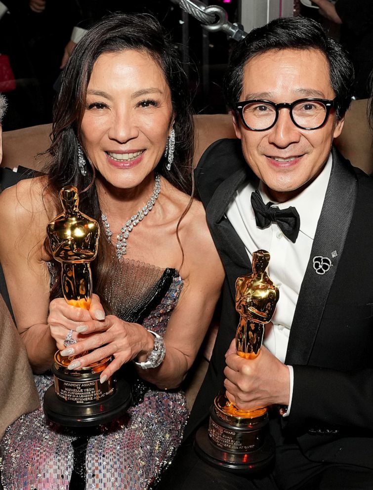 PHOTO: Michelle Yeoh and Ke Huy Quan hold their Oscars while attending the 2023 Vanity Fair Oscar Party, Mar. 12, 2023 in Los Angeles.