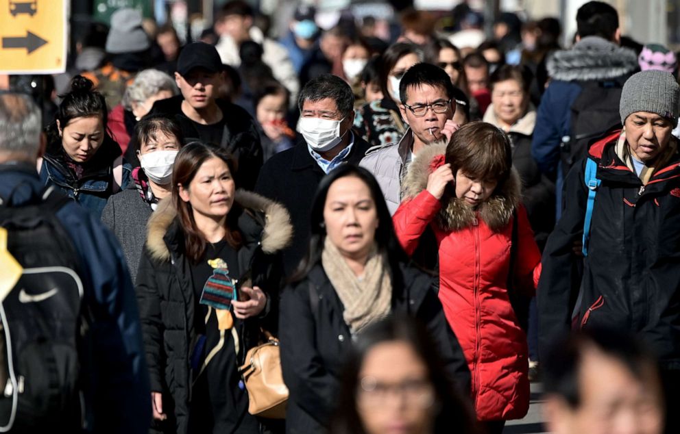 PHOTO: People walk along a street Queens, New York on Feb. 3, 2020.