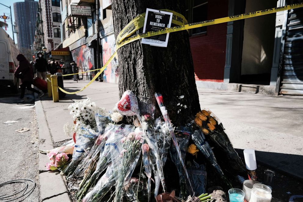 PHOTO: In this Feb. 15, 2022, file photo, flowers are set outside of the building where Christina Yuna Lee was murdered in the early hours of February 13th after she was followed home in New York.