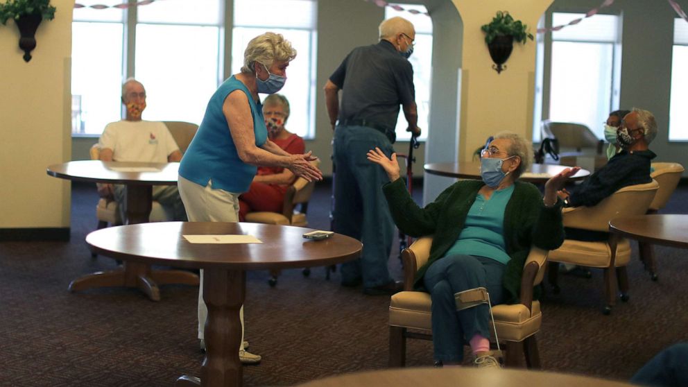 PHOTO: Erma Lee Hanna Roberts, 91, greets other residents after receiving the coronavirus disease (COVID-19) vaccine at Mission Commons assisted living community in Redlands, Calif., Jan. 15, 2021. 