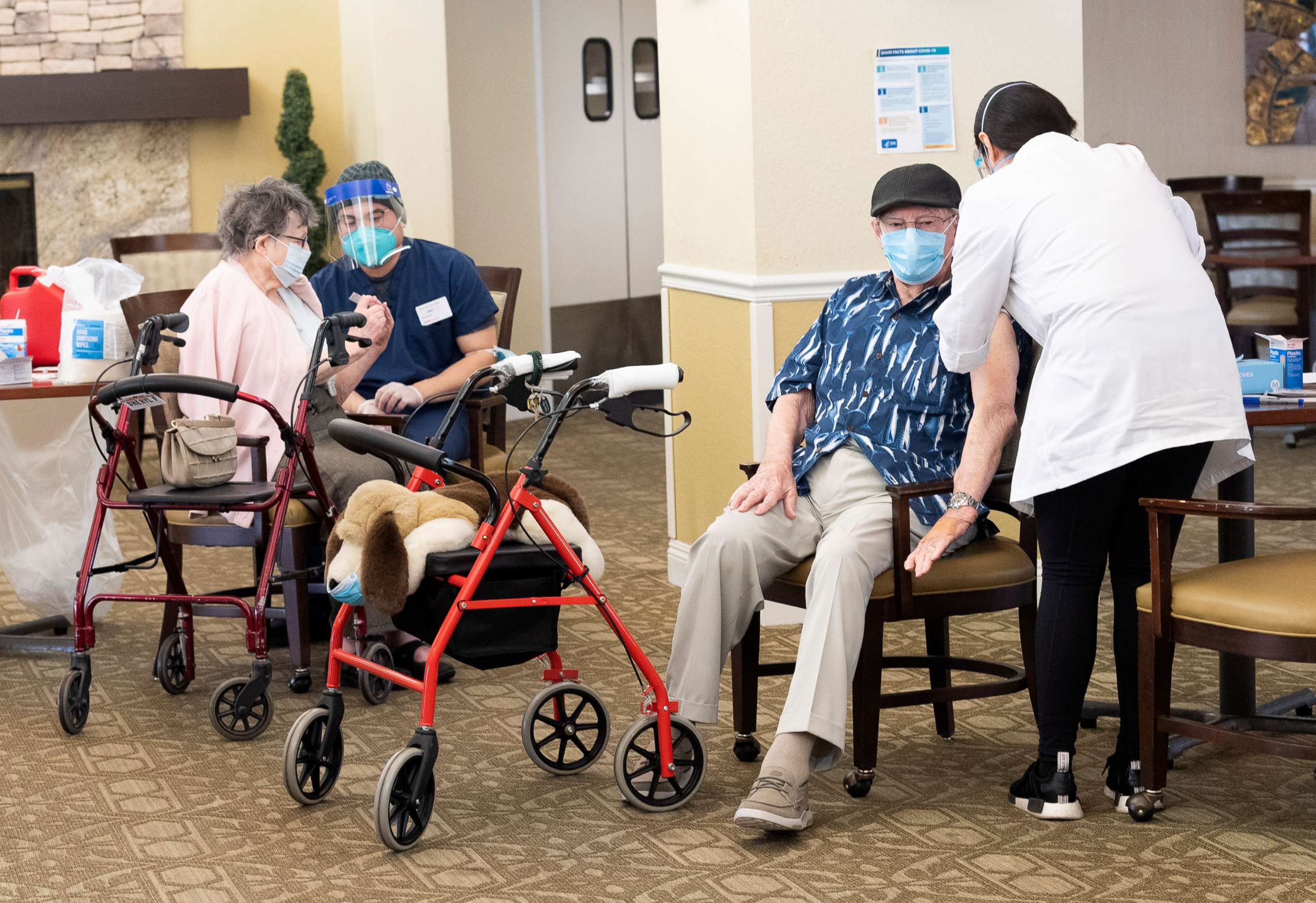 PHOTO: Residents get the Pfizer/BioNTech COVID-19 vaccine at the Emerald Court senior living community in Anaheim, Calif., Jan. 8, 2021. 