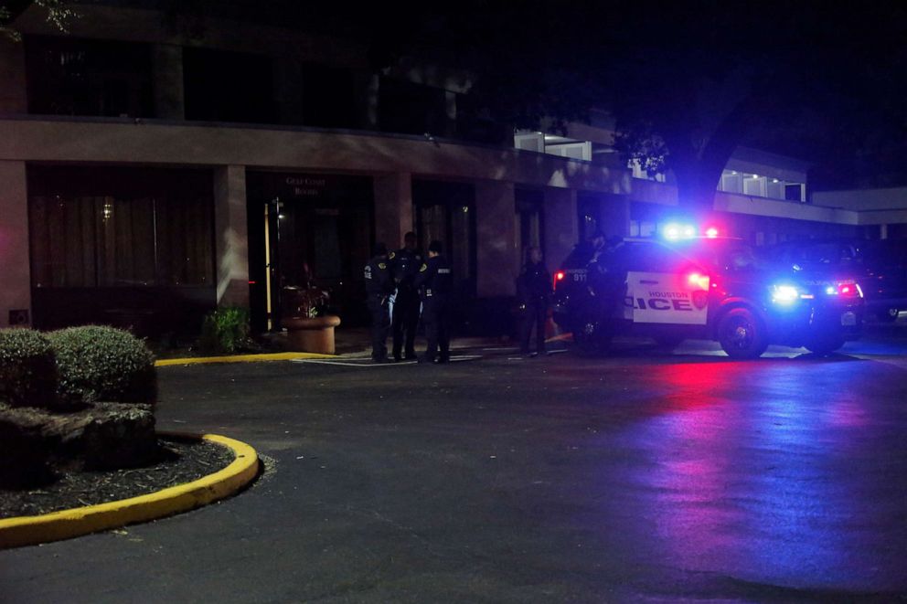 PHOTO: Police cars are seen outside a reunification center set up for missing attendees of the Astroworld music festival in Houston, Nov. 6, 2021.