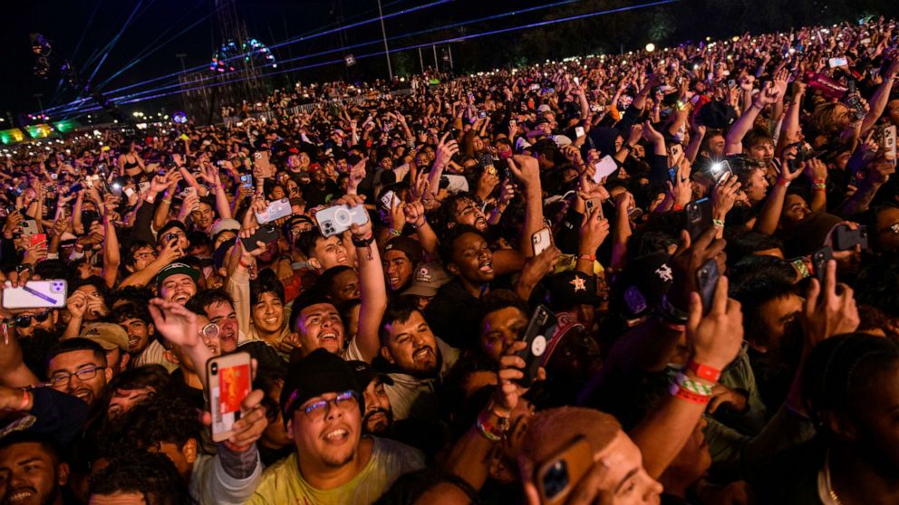PHOTO: The crowd watches as Travis Scott performs at Astroworld Festival, Nov. 5, 2021, in Houston. 