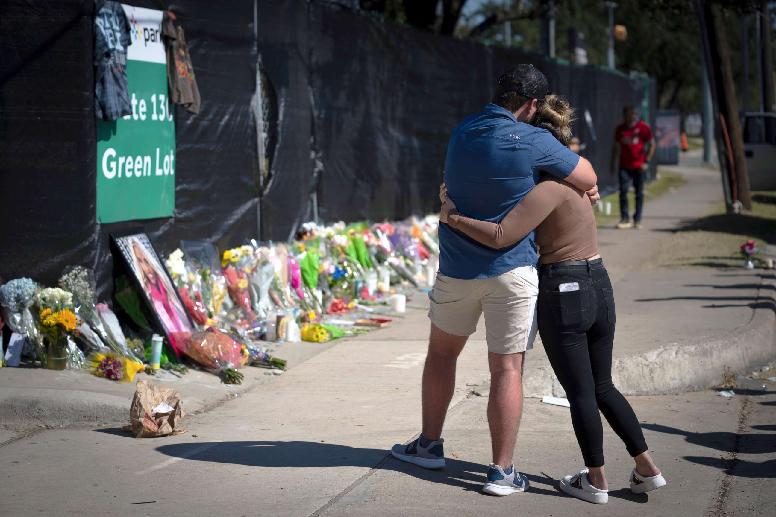 PHOTO: Two people who knew an unidentified victim of a fatal incident at the Astroworld concert embrace at a memorial on Nov. 7, 2021, in Houston.