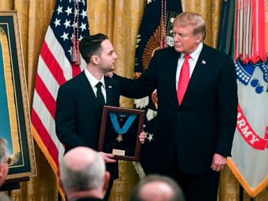 PHOTO: President Donald Trump presents a posthumous Medal of Honor for Army Staff Sergeant Travis Atkins, to his surviving son Trevor Oliver, during a ceremony in the East Room of the White House in Washington, DC, March 27, 2019.