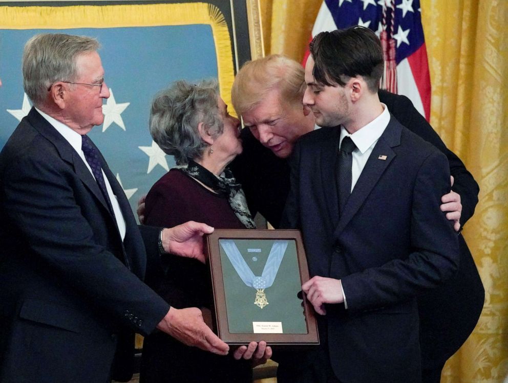 PHOTO: President Donald Trump leans in to talk with John and Elaine Atkins, the parents of the late Army Staff Sgt. Travis Atkins, as he presents them with the Medal of Honor in recognition of the battlefield actions in Washington, March 27, 2019.