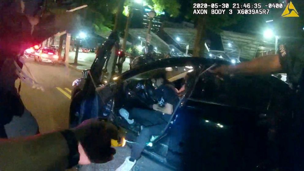 PHOTO: A still frame from Atlanta Police Department bodycam video footage of police officer Ivory Streeter, shows car driver Messiah Young being shot by a taser.