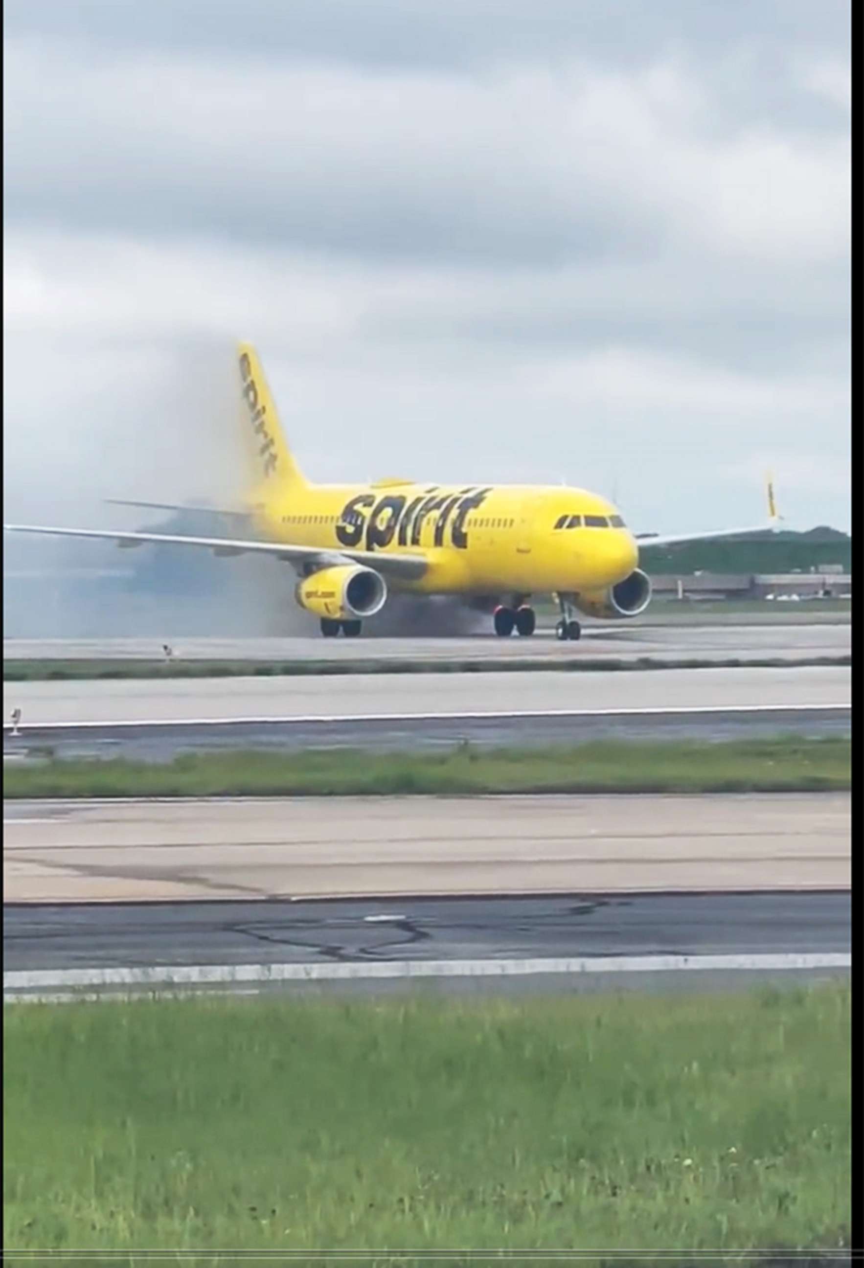 PHOTO: Smoke rises from a Spirit Airlines plane at airport in Atlanta, July 10, 2022.