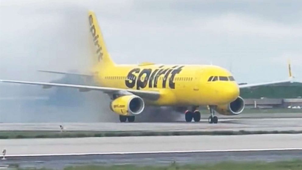Photo: Smoke rises from a Spirit Airlines plane at the airport in Atlanta on July 10, 2022.