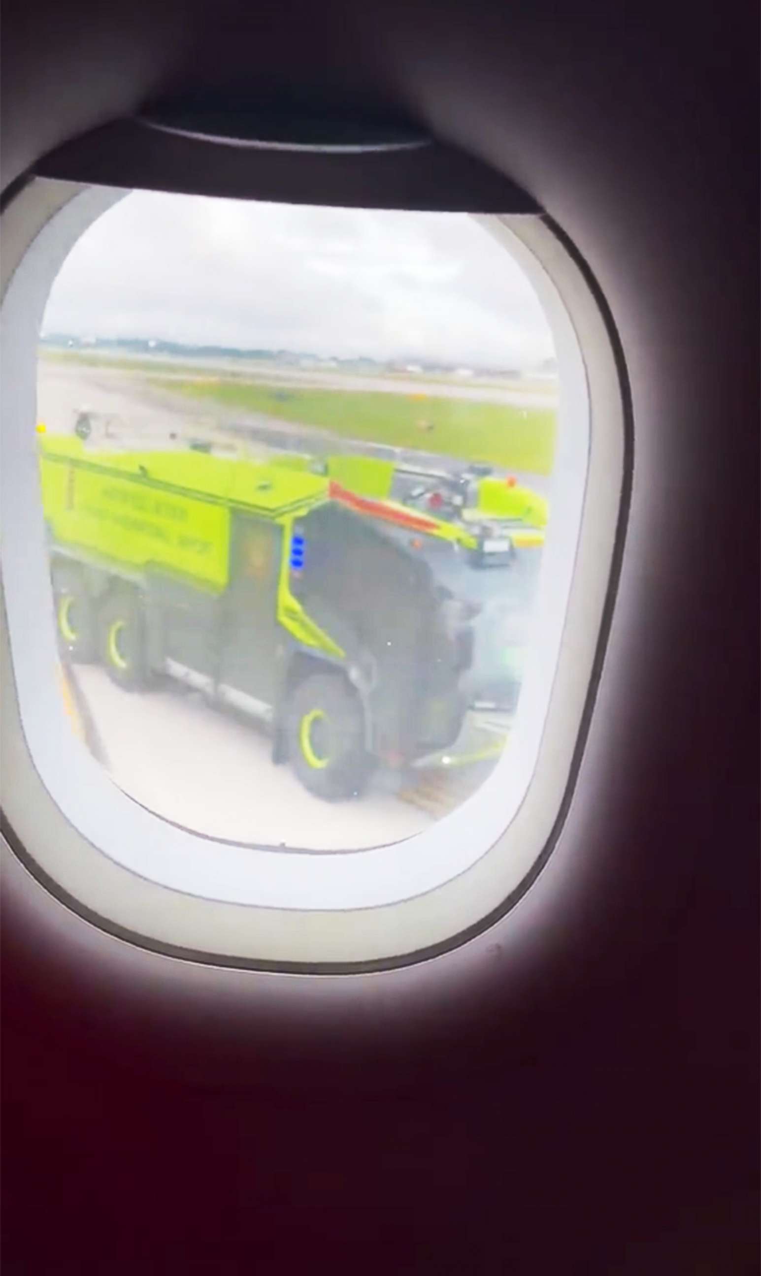 PHOTO: Emergency vehicles respond to a plane that caught fire on the tarmac of the airport in Atlanta, Juky 10, 2022.