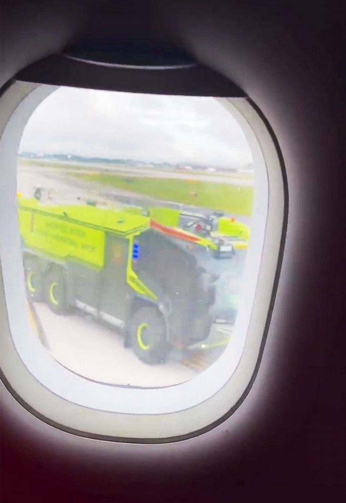 PHOTO: Emergency vehicles respond to a plane that caught fire on the tarmac of the airport in Atlanta, Juky 10, 2022.