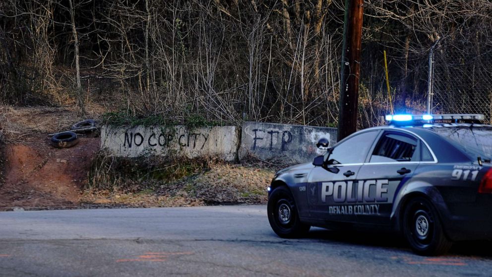PHOTO: Police drive past the planned site of a public safety training facility that opponents have nicknamed "Cop City" near Atlanta, Georgia, on Feb. 6, 2023.