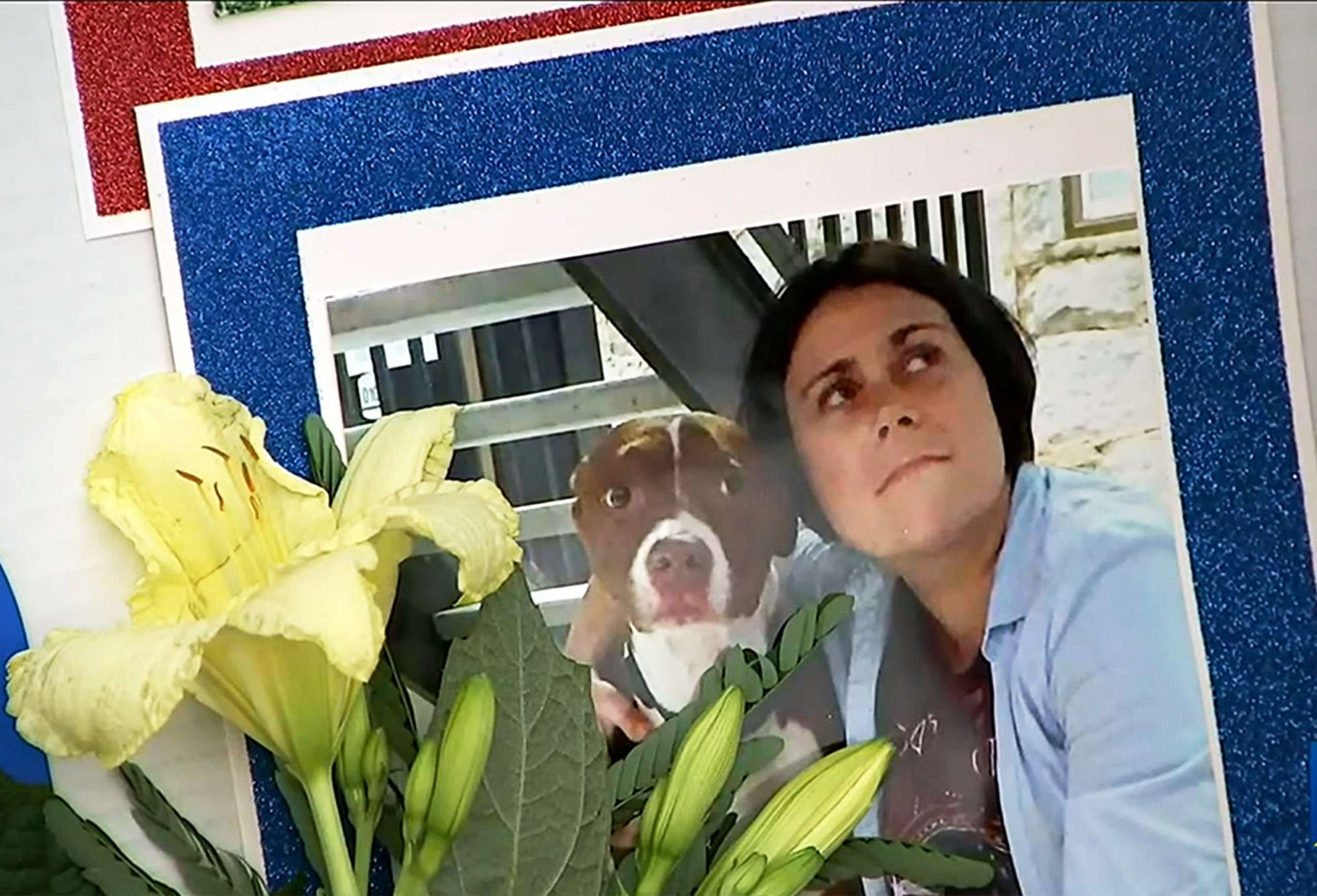PHOTO: A photo of Katie Janness and her dog Bowie is displayed as part of a memorial in Piedmont Park in Atlanta, Ga., July 30, 2021. 