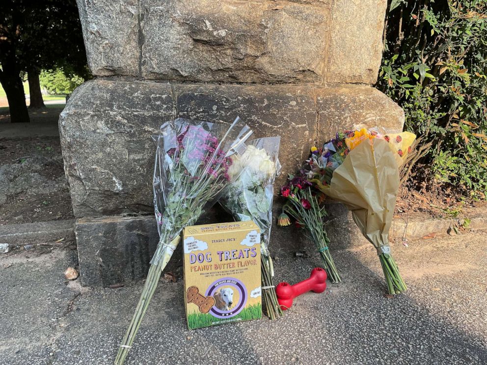 PHOTO: TA memorial for Katherine Janness and her dog Bowie begins to form at Piedmont Park in Atlanta, July 28, 2021.  Janness, 40, was found dead in Piedmont Park around 1 a.m. Wednesday, police said. Her dog had also been killed.