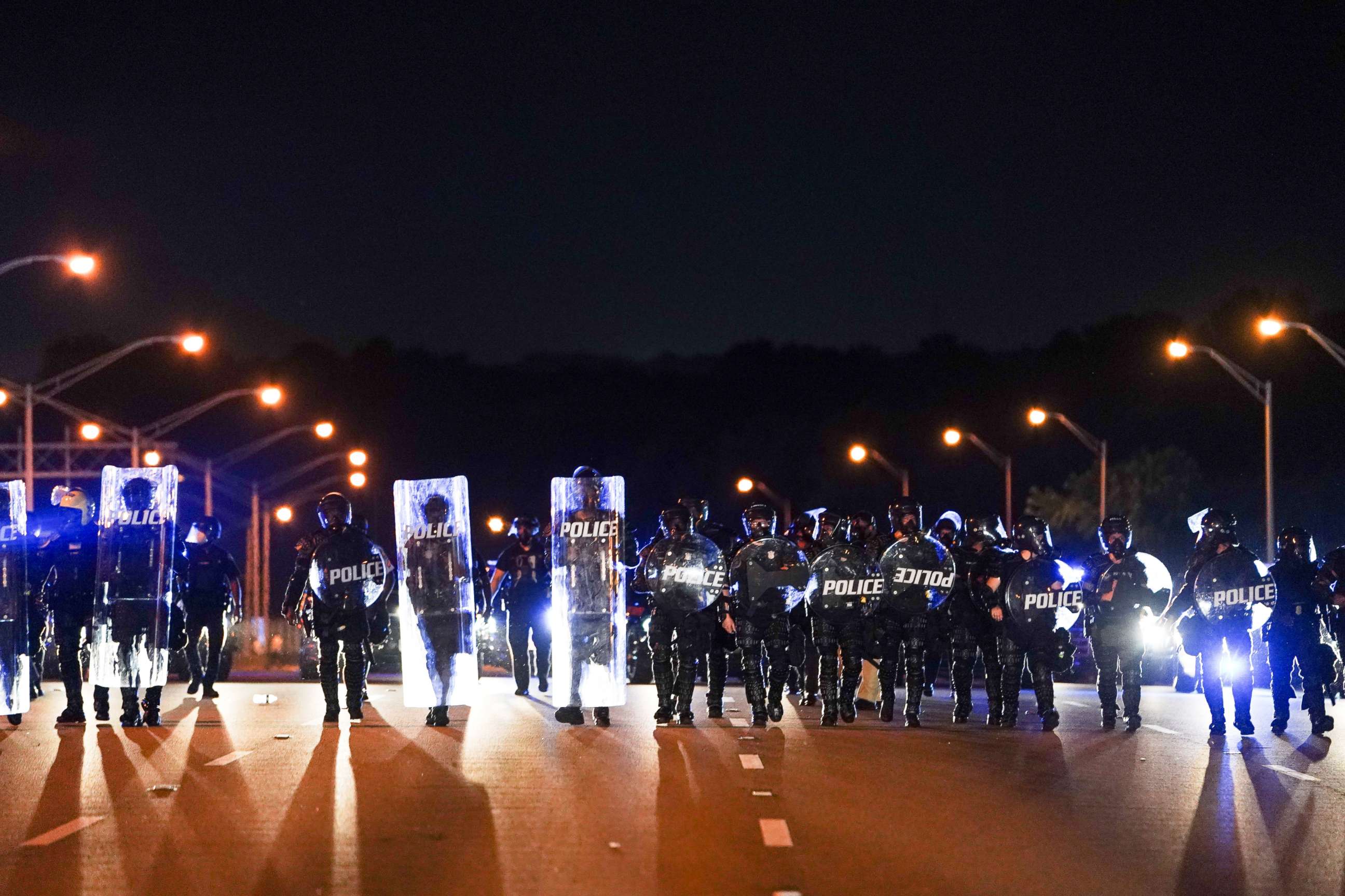 PHOTO: Police with riot shields advance to detain protesters for blocking traffic on a freeway, during a rally against racial inequality and the police shooting death of Rayshard Brooks, in Atlanta, Georgia, on June 13, 2020.