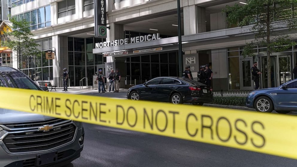 PHOTO: Police officers work the scene of a shooting at a Northside Hospital medical facility, on May 3, 2023, in Atlanta.