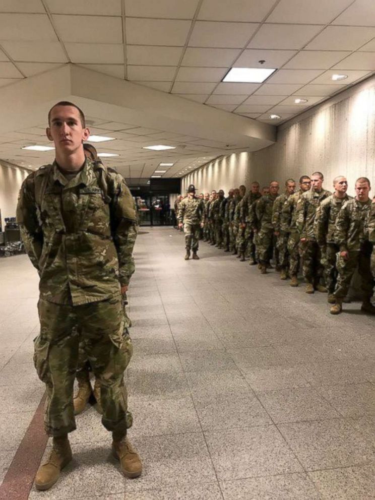 PHOTO: Accompanied by their drill instructors Army recruits from Fort Benning, Georgia arrive at Atlanta's Hartsfield-Jackson International Airport headed home for the holidays.