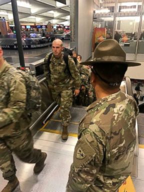 PHOTO: Accompanied by their drill instructors Army recruits from Fort Benning, Georgia arrive at Atlantas Hartsfield-Jackson International Airport headed home for the holidays.