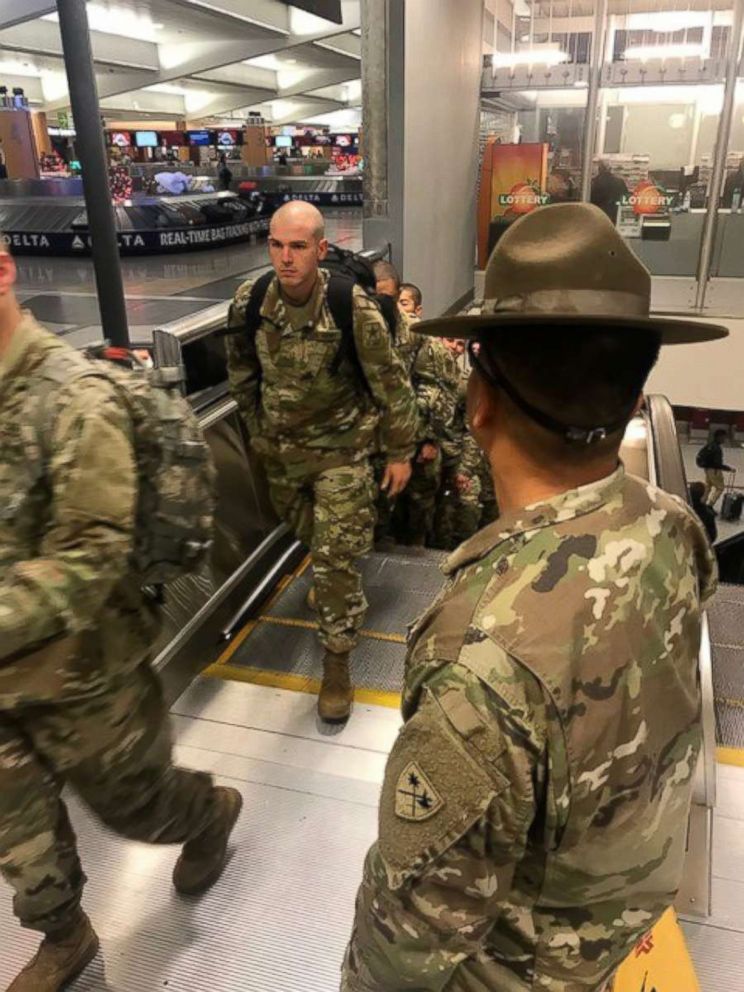 PHOTO: Accompanied by their drill instructors Army recruits from Fort Benning, Georgia arrive at Atlanta's Hartsfield-Jackson International Airport headed home for the holidays.