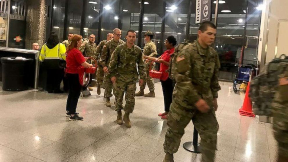 USO Volunteers greet the thousands of Army recruits from Fort Benning, Georgia who arrived at Atlanta's Hartsfield-Jackson International Airport to begin a week's leave for the holiday season.
