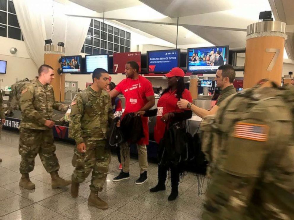 PHOTO: USO Volunteers greet the thousands of Army recruits from Fort Benning, Georgia who arrived at Atlanta's Hartsfield-Jackson International Airport to begin a week's leave for the holiday season.
