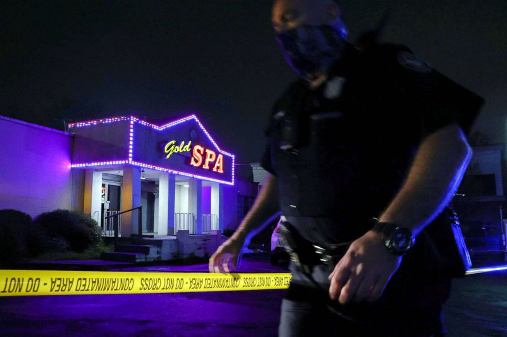 PHOTO: City of Atlanta Police Officer Davis works at the scene outside of Gold Spa after deadly shootings in the Atlanta area, in Atlanta, March 16, 2021.