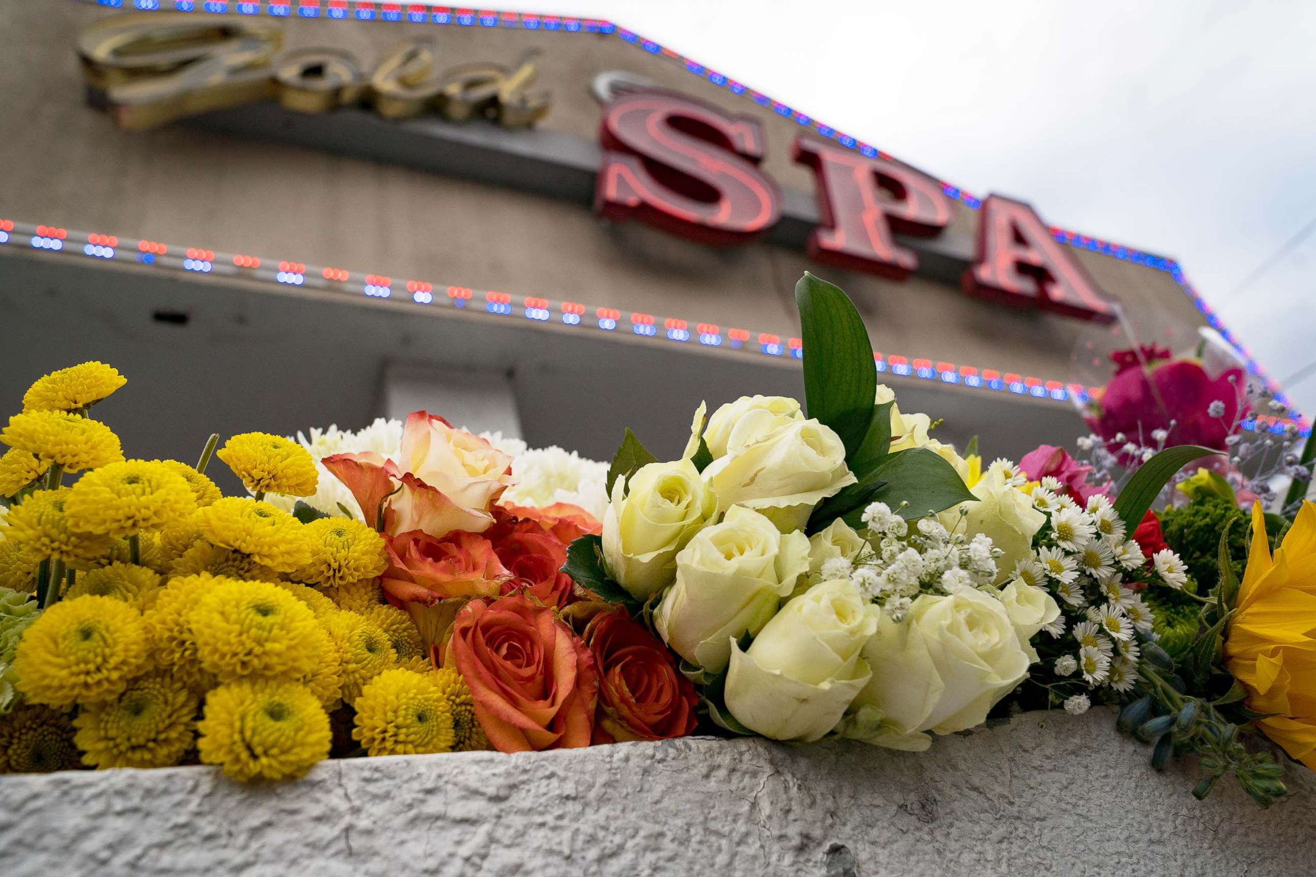PHOTO: Flowers adorn Gold Spa during a demonstration against violence towards women and Asians following Tuesday night's shooting in which three women were gunned down  in Atlanta, March 18, 2021.