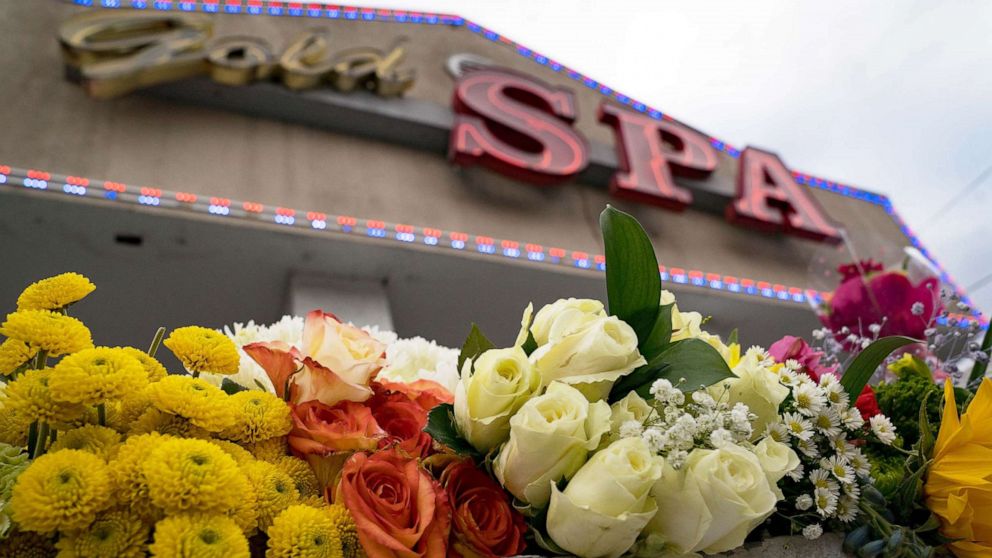 PHOTO: Flowers adorn Gold Spa during a demonstration against violence towards women and Asians following Tuesday night's shooting in which three women were gunned down  in Atlanta, March 18, 2021.