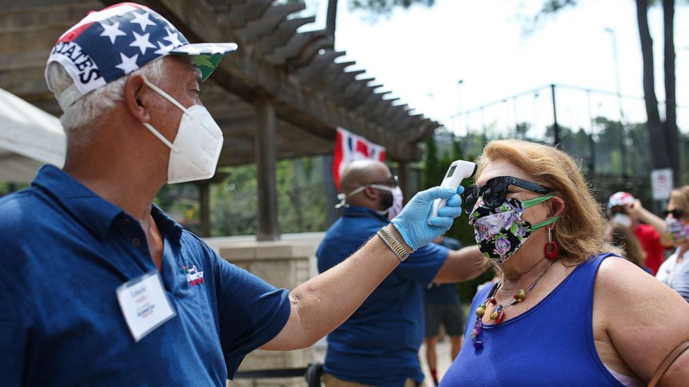 PHOTO: Fans have their temperature screened prior to entering the DraftKings All-American Team Cup on July 4, 2020, in Atlanta.
