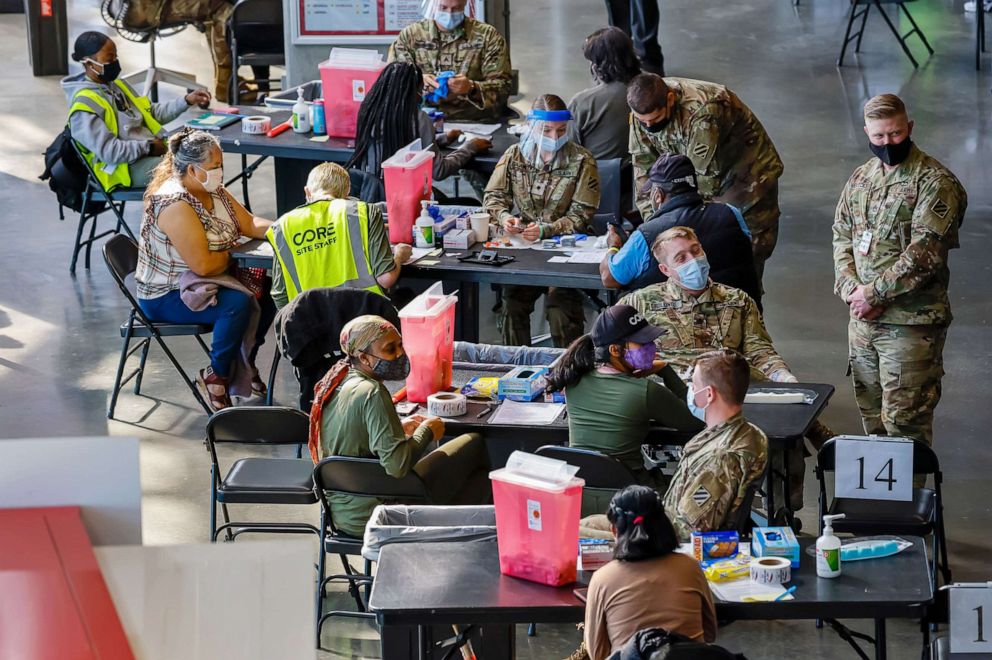 PHOTO: U.S. Army medics administer shots at the Mercedes-Benz Stadium Community Vaccination Center, a jointly run COVID-19 mass vaccination site, in Atlanta, March 29, 2021.