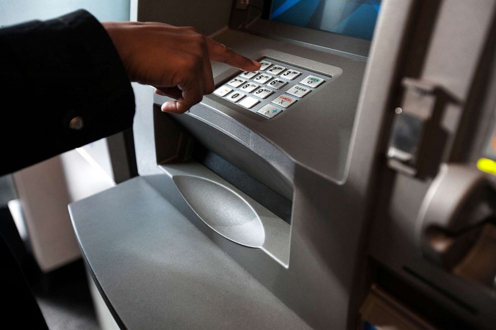 PHOTO: A person at an ATM machine in an undated stock photo.
