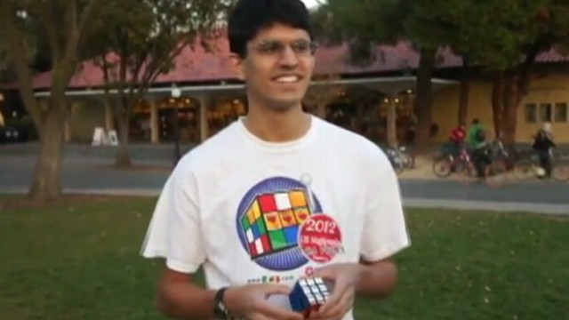 VIDEO: Stanford University student Ravi Fernando solves a Rubiks Cube while juggling it.