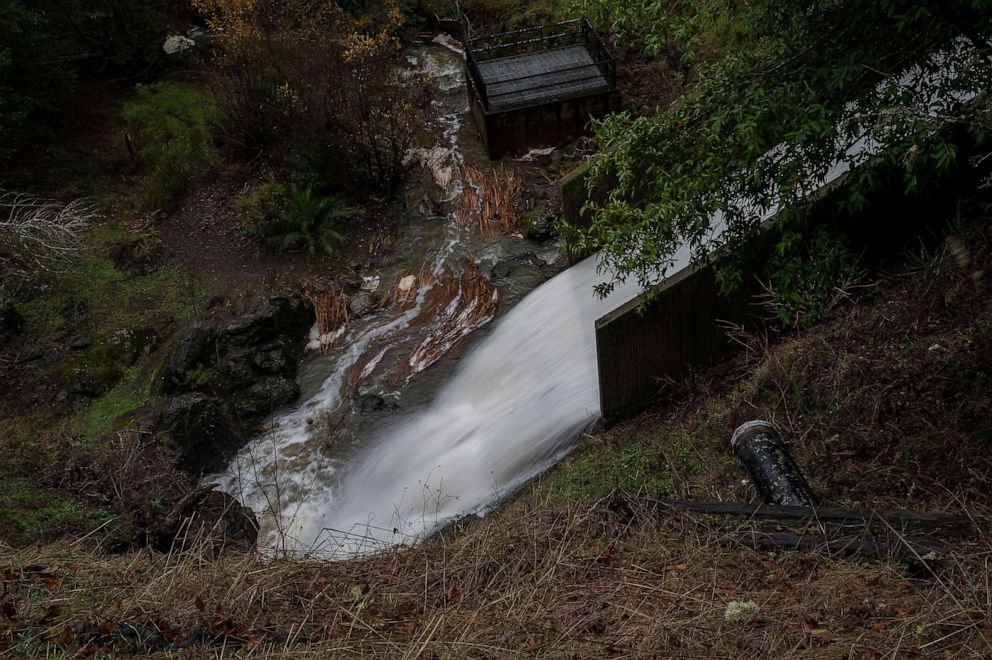 PHOTO: Water flows from Phoenix Lake, Dec. 30, 2022, in Ross, California.