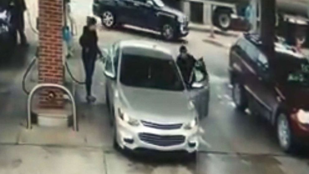 PHOTO: Surveillance video shows an unidentified man jumping into a woman's car at a gas station in Allen Park, Mich., Oct. 12, 2017.