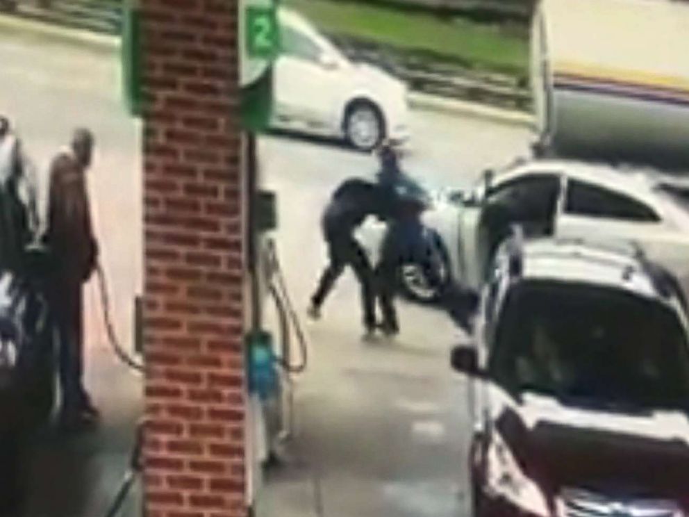 PHOTO: Surveillance footage shows a good Samaritan struggling with an unidentified man who attempted to steal a womans car in broad daylight at a gas station in Allen Park, Mich., Oct. 12, 2017.