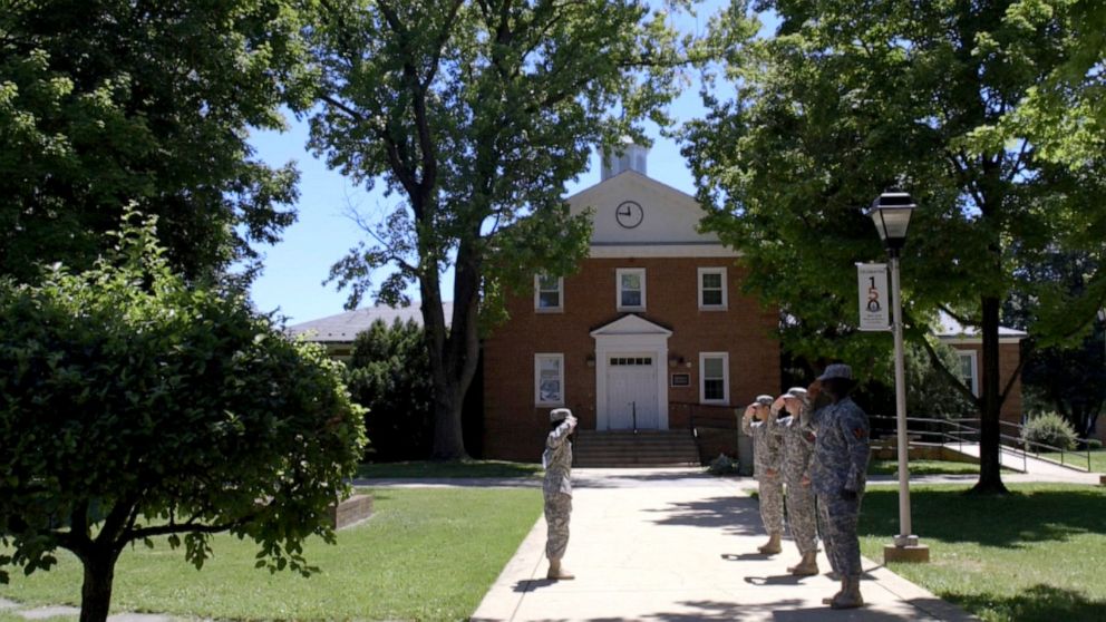 PHOTO: High school cadets stand at attention and salute outside the Maryland School for the Deaf in Fredrick, Md.
