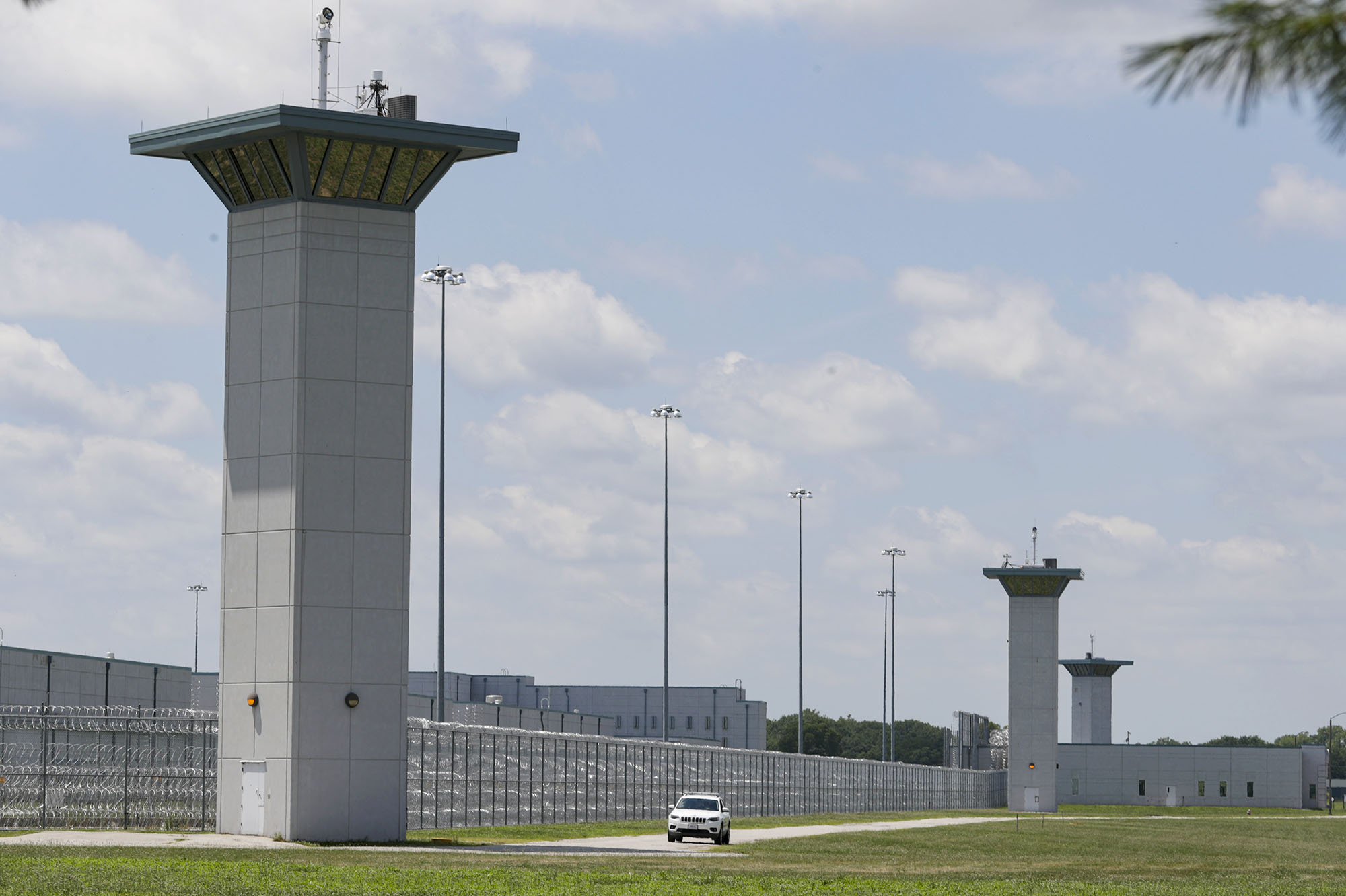 PHOTO: A vehicle patrols that perimeter of the federal prison complex in Terre Haute, Ind., July 17, 2020. 