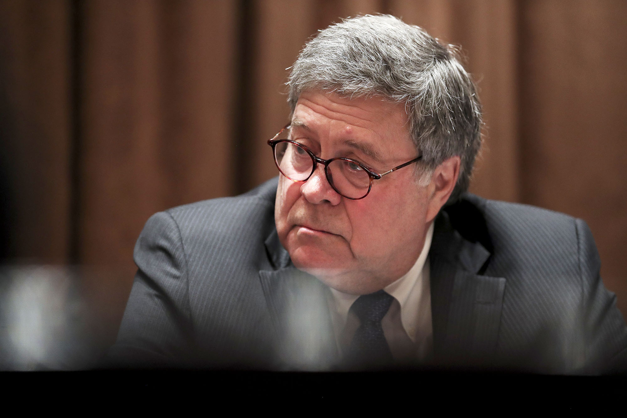 PHOTO: William Barr listens during a meeting with Republican State Attorneys General in the Cabinet Room of the White House, Sept. 23, 2020. 