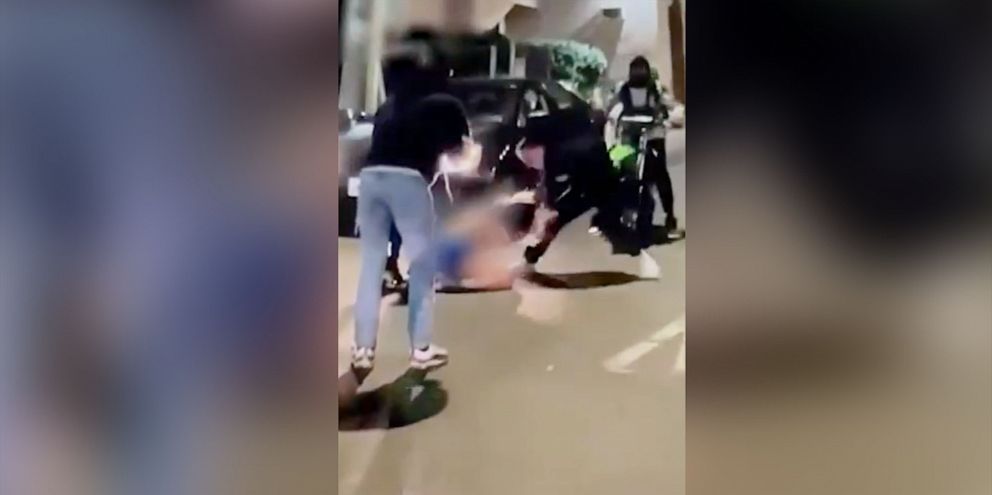 PHOTO: Cell phone footage that is part of a police investigation shows a woman being attacked after pulled from her car by ATV and dirt bike riders in Providence, Rhode Island, on Aug. 3, 2021.